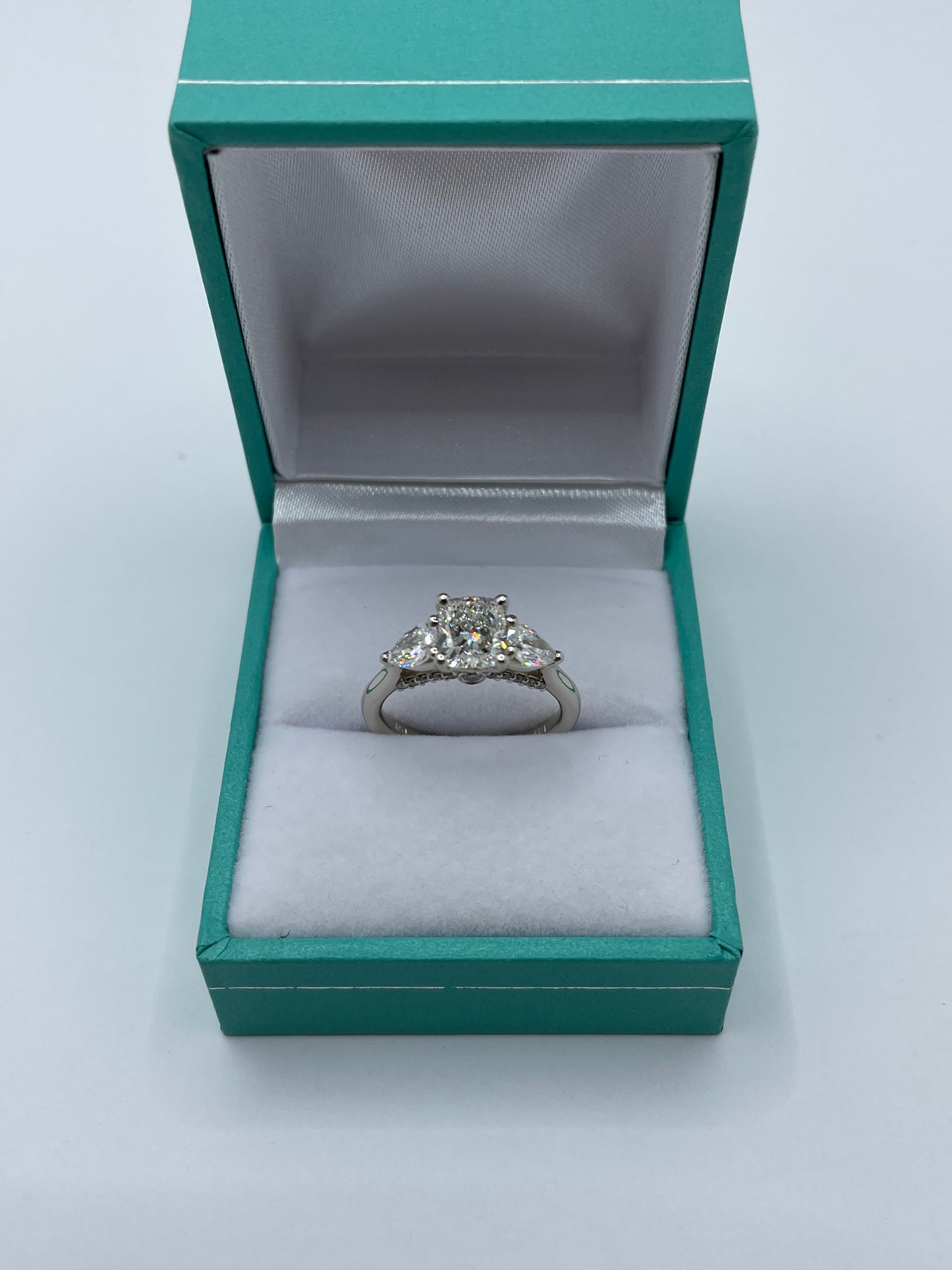 14k White Gold Cushion Cut Center Stone Ring with 2 pear cut stones