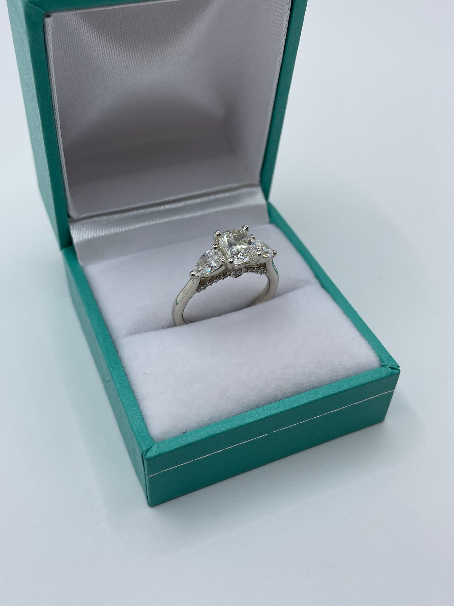 14k White Gold Cushion Cut Center Stone Ring with 2 pear cut stones
